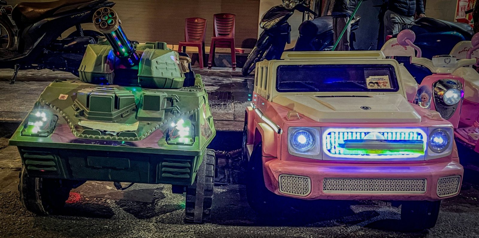 A couple of cars that are sitting in the street