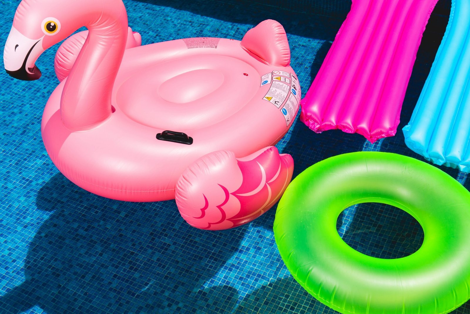 Summer Fun: Inflatable Pool Floats Kids Will Love 3 pink inflatable flamingo and green inflatable ring