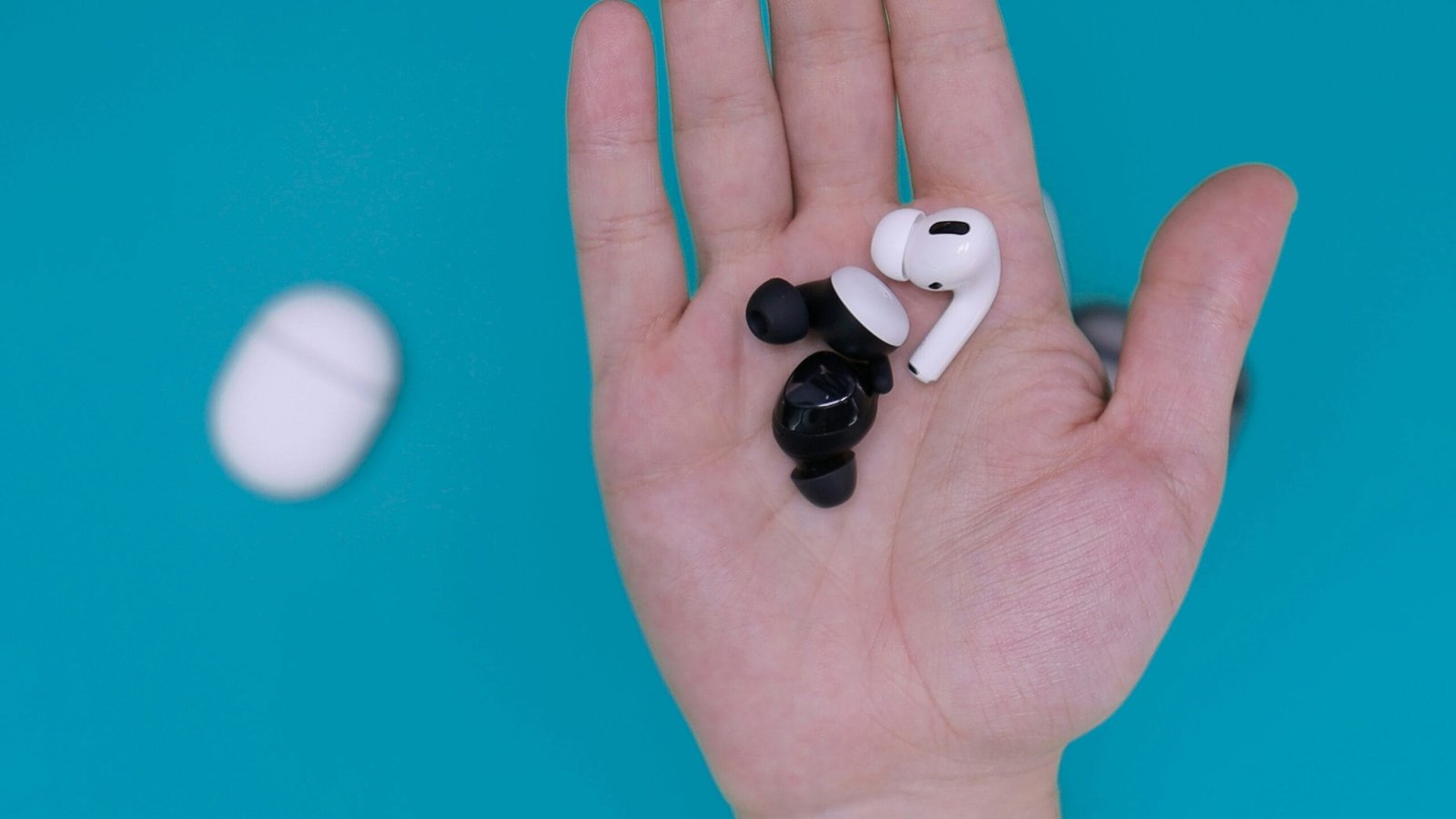 Top Earbuds of 2025: Reviews and Features of Apple AirPods Pro 3 and Jabra Elite 8 Active 6 white and black earbuds on persons hand